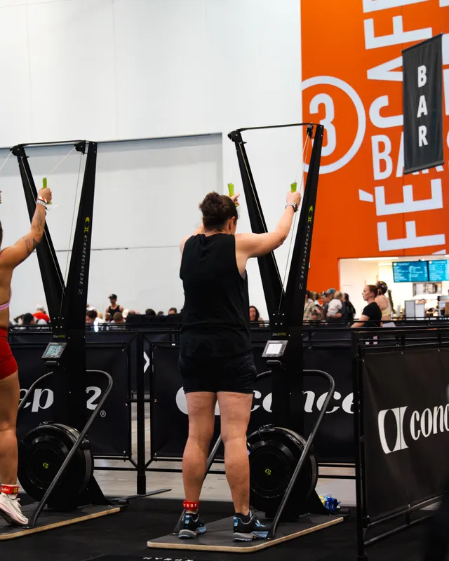 Competitors on the SkiErg machines at a HYROX Perth event